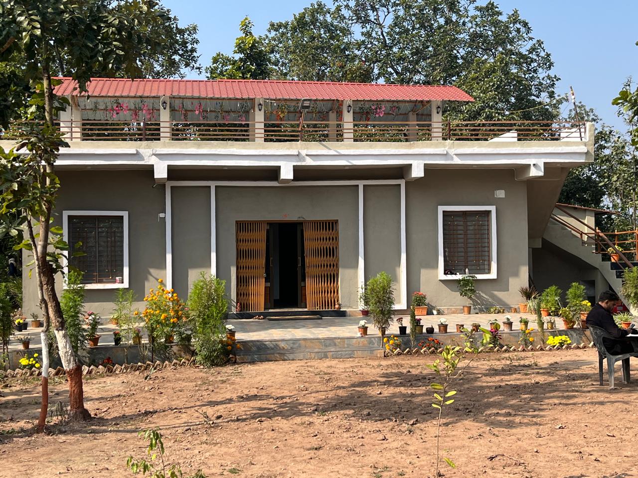 Luxury resort pool with palm trees at sunset